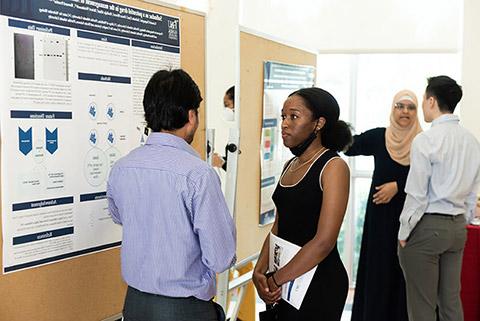 Graduate students at annual graduate research day presenting work