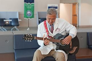 Richard D. Shih, M.D. playing the guitar